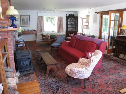 Living room with dining table in the rear.