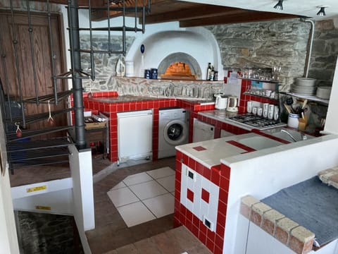 Kitchen with feature pizza oven. Please note this is no longer a working oven. 