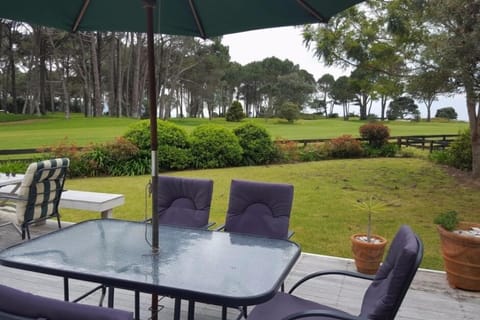 View of golf course and ocean from deck