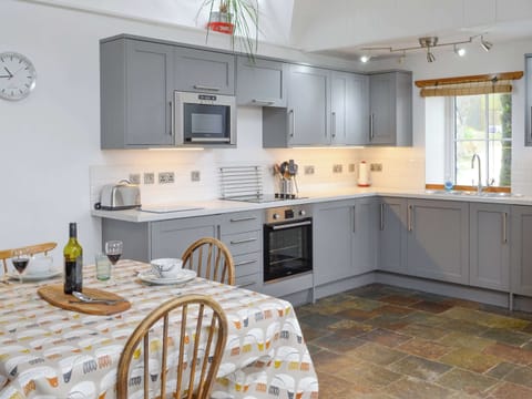 Fully appointed kitchen with dining area | The Old Dye House, Hallin