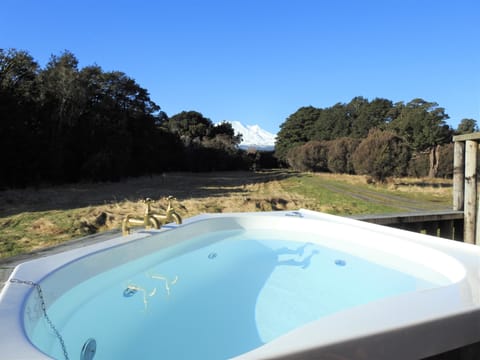 Hot tub on deck with mountain views