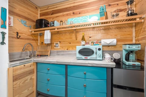 Fully equipped kitchenette: induction cooktop, microwave, Keurig & essentials for easy meals.”