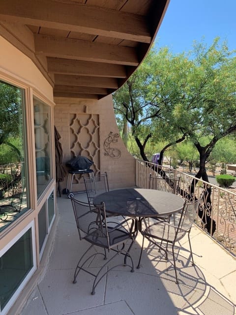 Large patio overlooking city with barbecue grill 