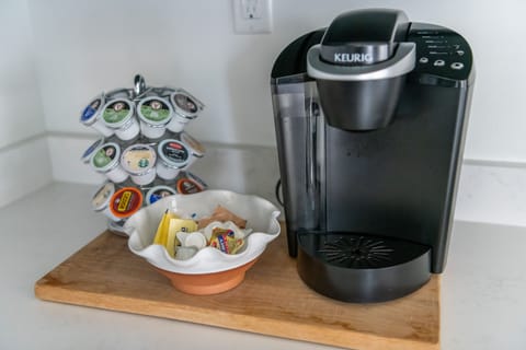 Keurig with assorted coffees, sugar and creamer 