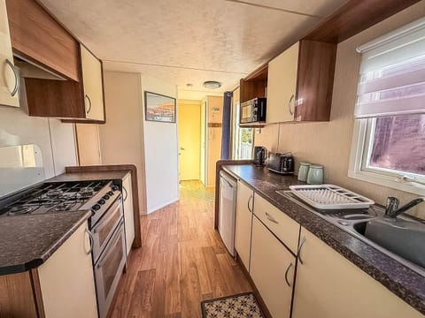 Bright, cozy kitchen with modern appliances and natural light