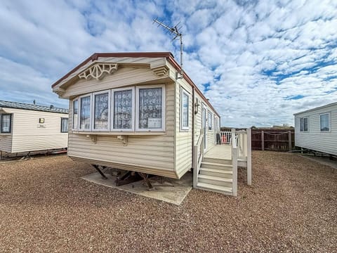 Cozy exterior with charming bay windows and private deck