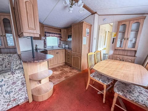 Cozy kitchen and dining area with warm wood accents