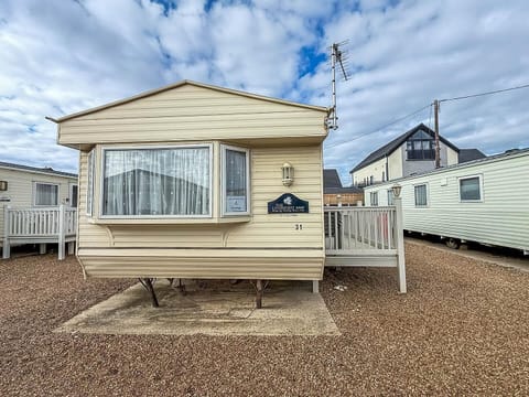 Cozy mobile home with bright bay window and private deck
