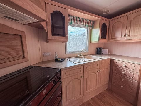 Cozy kitchen with ample storage and natural light