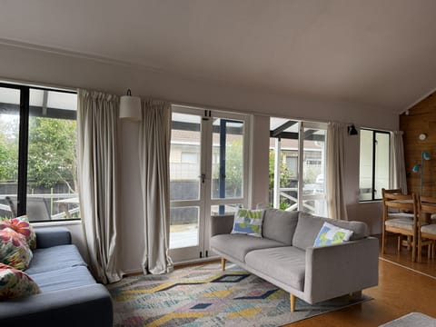 Another seating space and 2 sets of french doors to the deck
