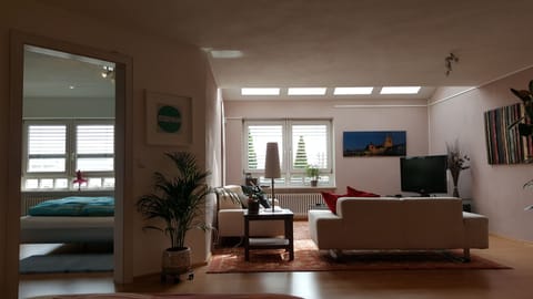 Living room and bedroom to the left
