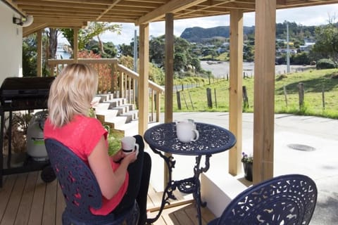 Deck with view of beach and Mt Manaia