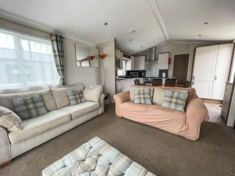 The caravan living area offers the ideal setting for families to gather for game nights or for couples to enjoy a quiet evening, creating cherished memories on your perfect getaway.