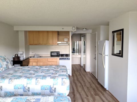 full kitchen with full size refrigerator.