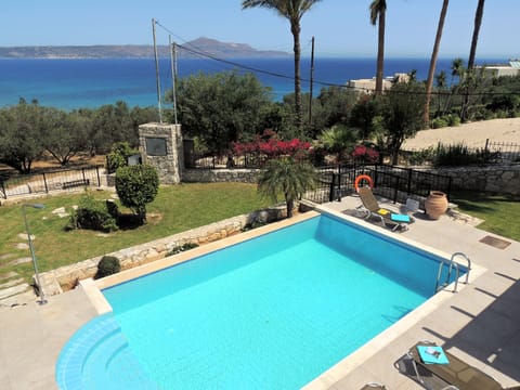 01 Amira pool, garden, and sea view.