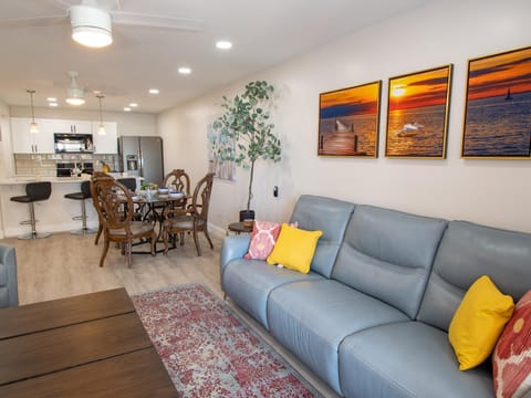 Leather sofa with reclining end seats