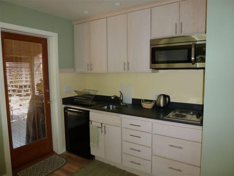 Refrigerator, stove top, microwave.  We  machine wash dishes between guests.