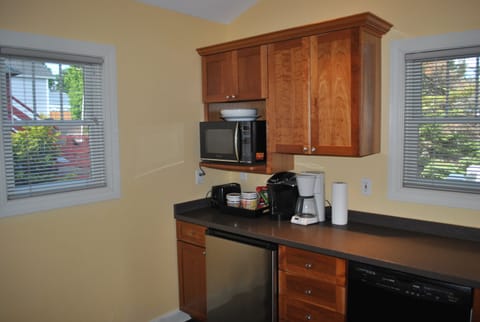 1st Level kitchen well appointed with microwave, (2) refrigerators, and more.