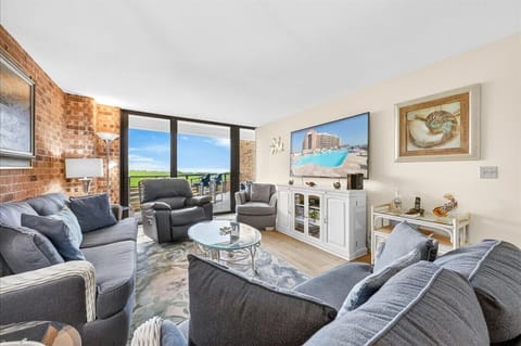 Inviting Living Area with Patio Access and Coastal Views