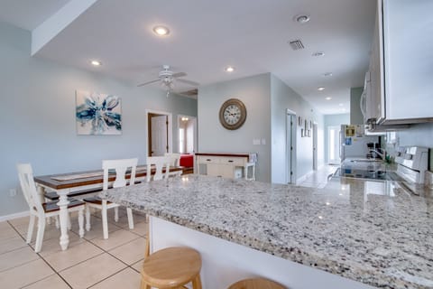 Kitchen - Additional seating is offered at the bar in the kitchen for convenience.