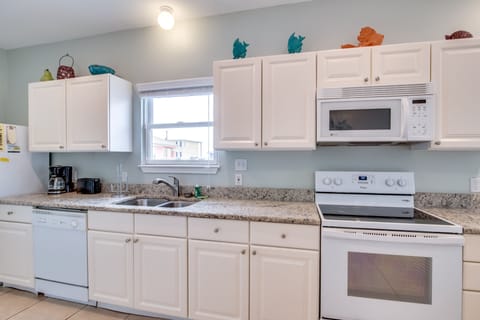 Kitchen - The spacious kitchen is fully stocked with dishes, cookware, glassware, pot & pans...basically all you could need to prepare your meals on site