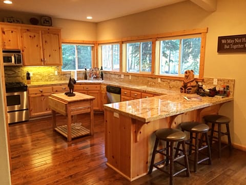 Granite counters and chopping block island with plenty of room to cook!