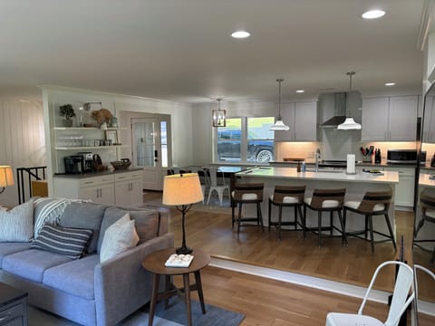 Main level living room with kitchen. Dining table 8 people, Island 4 people.