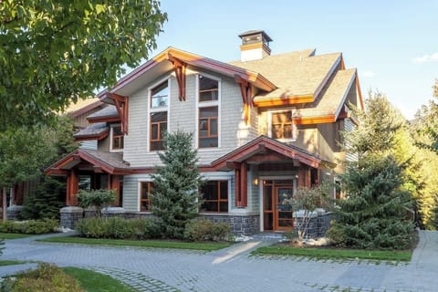 - Beautiful alpine home with rustic wood beams and stone accents  
- Surrounded by evergreens creating a serene mountain retreat vibe  
- Perfect base for ski adventures and year-round outdoor escapes 