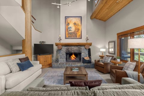 - Warm up by the glowing stone fireplace in this inviting lodge  
- Vaulted ceilings and mountain décor create a true alpine ambiance  
- Gather for movie nights or fireside chats in this cozy living space  