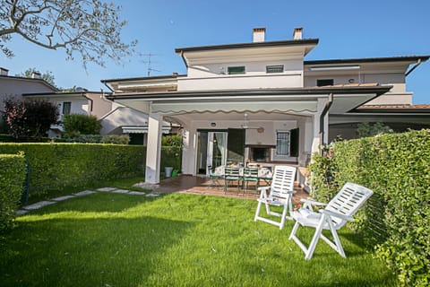 The house with it's garden and covered terrace