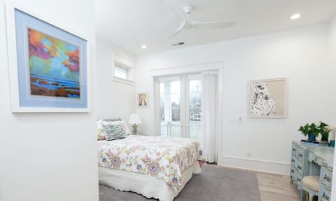 East Suite. Queen. French doors to balcony. Ceiling fan. Original paintings/art.