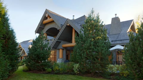 - Charming alpine home surrounded by evergreens  
- Beautiful architecture with stone and timber details  
- A tranquil retreat nestled in natural mountain beauty  
