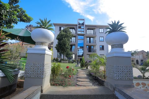 Front view of the apartment building taken from the pool area