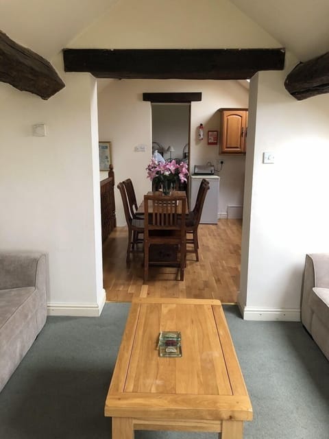 sitting room leading to kitchen and bedroom