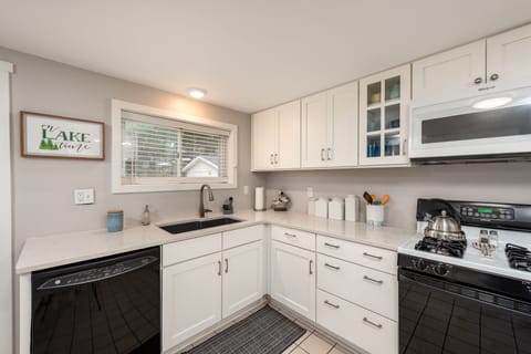 Well equipped kitchen with dishwasher and gas stove