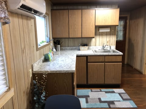 Kitchen, shows back door to deck