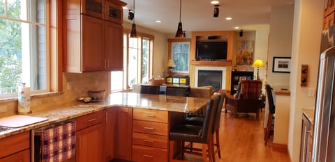 Main floor kitchen/living room. Bar seats 4. Console table seats 4.