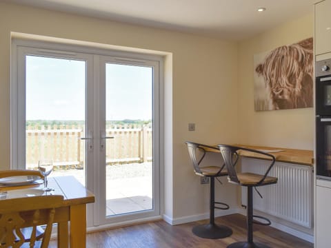 French doors from kitchen/diner to patio area | Stars Cottage, Moreton, near Wareham