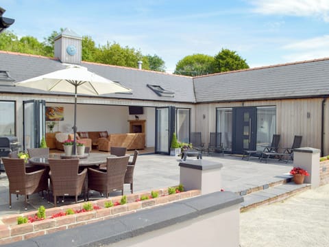 Large patio area with outdoor furniture | Manor Lodge Stables, Wiston, near Haverfordwest