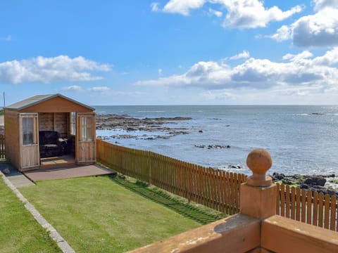 Lawned garden with Summerhouse | Seashore Retreat, Johnshaven, near Montrose