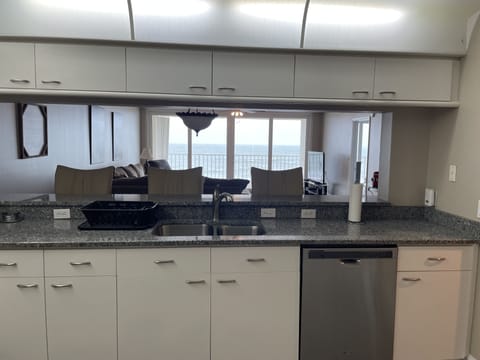 View from inside the kitchen looking into the living area