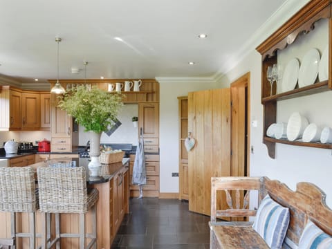 Well-equipped kitchen with useful kitchen &rsquo;Island&rsquo; | Maes Y Bryn Farmhouse, Llansadwrn, near Llandeilo
