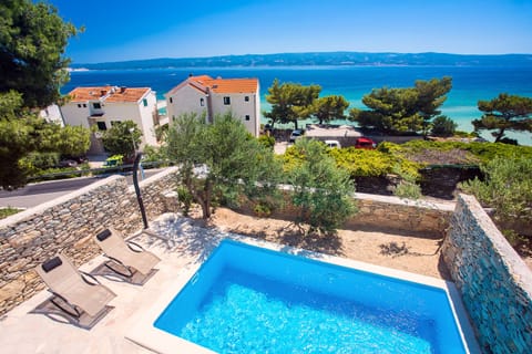 Beautiful view on the pool area and nearby sea.