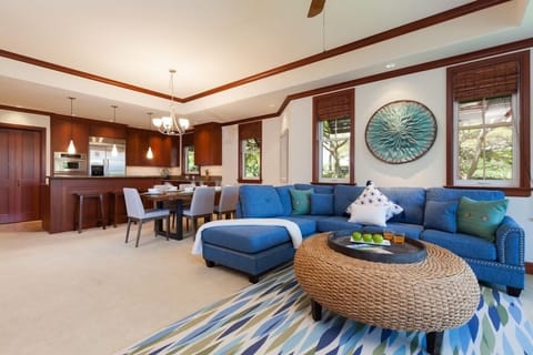 Open concept layout connects living room, dining, and kitchen