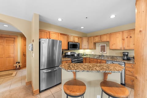Full kitchen with stainless steel appliances