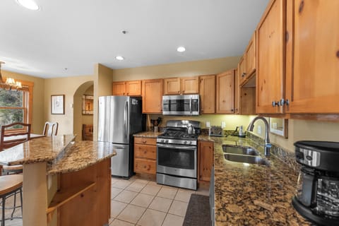 Full kitchen with stainless steel appliances