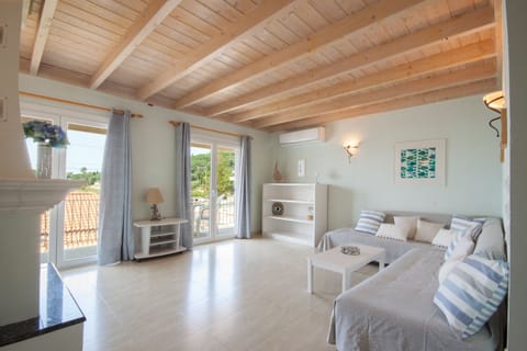 Open plan living room with sea views over Kalimones Bay