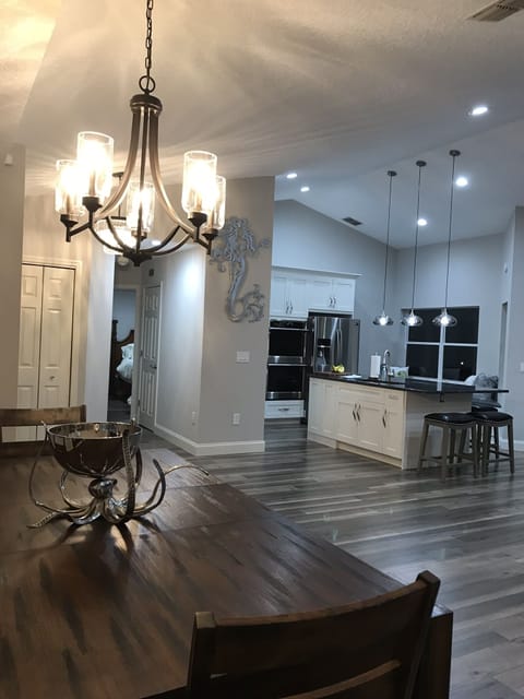 Open concept living area, full kitchen, & island seating.