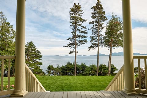 Grand and Elegant porch opening up to Frenchman Bay and the spacious lawn!