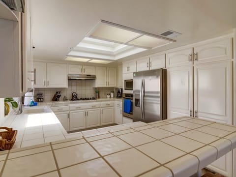 Large Kitchen with Pantry, Refrigerator, Oven, Microwave, and Gas Stove